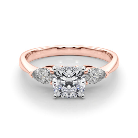 Rose gold Three-Stone Cushion Diamond Ring with Pear Side Stones on a Platinum Band with Four-Prong Setting