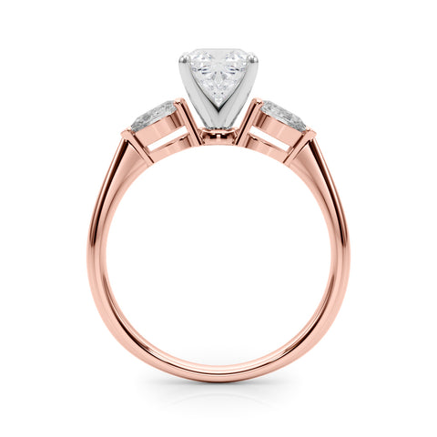 Rose gold Three-Stone Cushion Diamond Ring with Pear Side Stones on a Platinum Band with Four-Prong Setting