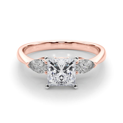 Rose gold Three-Stone Princess Diamond Ring with Pear Side Stones on a Platinum Band with Four-Prong Setting