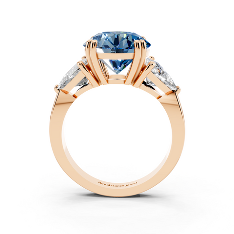 Rose gold Fancy Blue Round cut Brilliant and Trilliant Diamond Three-Stone Ring