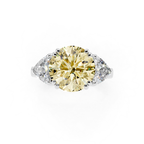Platinum Fancy Yellow Round cut Brilliant and Trilliant Diamond Three-Stone Ring