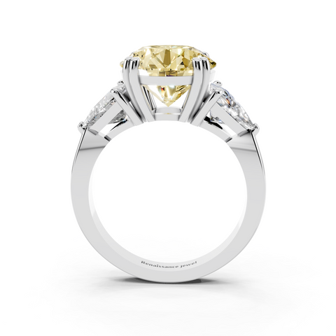 Platinum Fancy Yellow Round cut Brilliant and Trilliant Diamond Three-Stone Ring