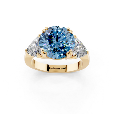 Yellow gold Fancy Blue Round cut Brilliant and Trilliant Diamond Three-Stone Ring