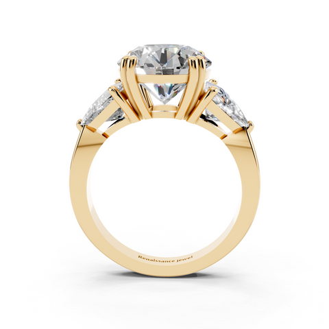 Yellow gold Round Brilliant and Trilliant Diamond Three-Stone Ring