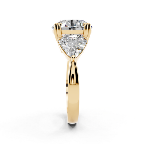 Yellow gold Round Brilliant and Trilliant Diamond Three-Stone Ring