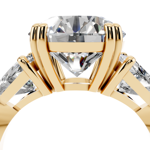 Yellow gold Round Brilliant and Trilliant Diamond Three-Stone Ring