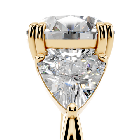 Yellow gold Round Brilliant and Trilliant Diamond Three-Stone Ring