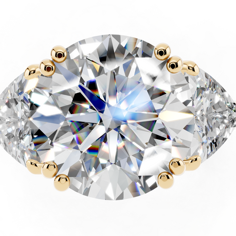 Yellow gold Round Brilliant and Trilliant Diamond Three-Stone Ring