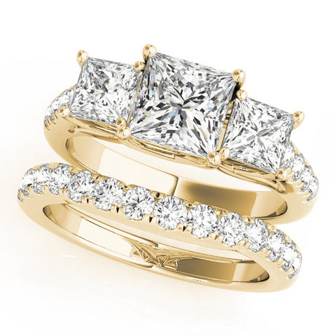 Yellow gold Three-Stone Princess Cut Diamond Ring with Pavé Band and Prong Setting