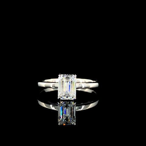 Emerald Solitaire Engagement Ring with Silver Band and Four-Prong Setting 1