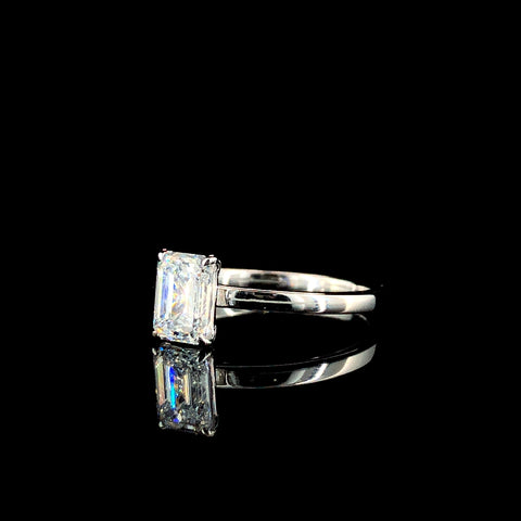 Emerald Solitaire Engagement Ring with Silver Band and Four-Prong Setting