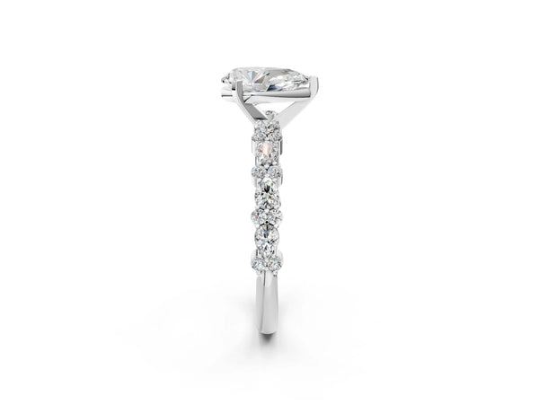 1 Carat Pear Cut Platinum Diamond Side Stone Solitaire Ring with Round and Four-Prong Setting