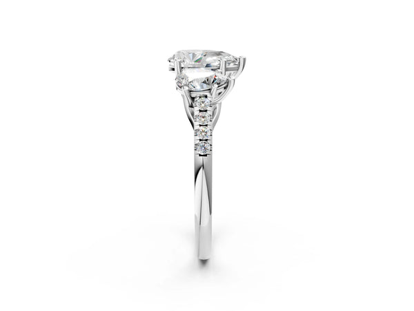 Platinum 1 Carat Three-Stone Pear Cut Diamond Ring with Round  Pavé Band and Prong Setting