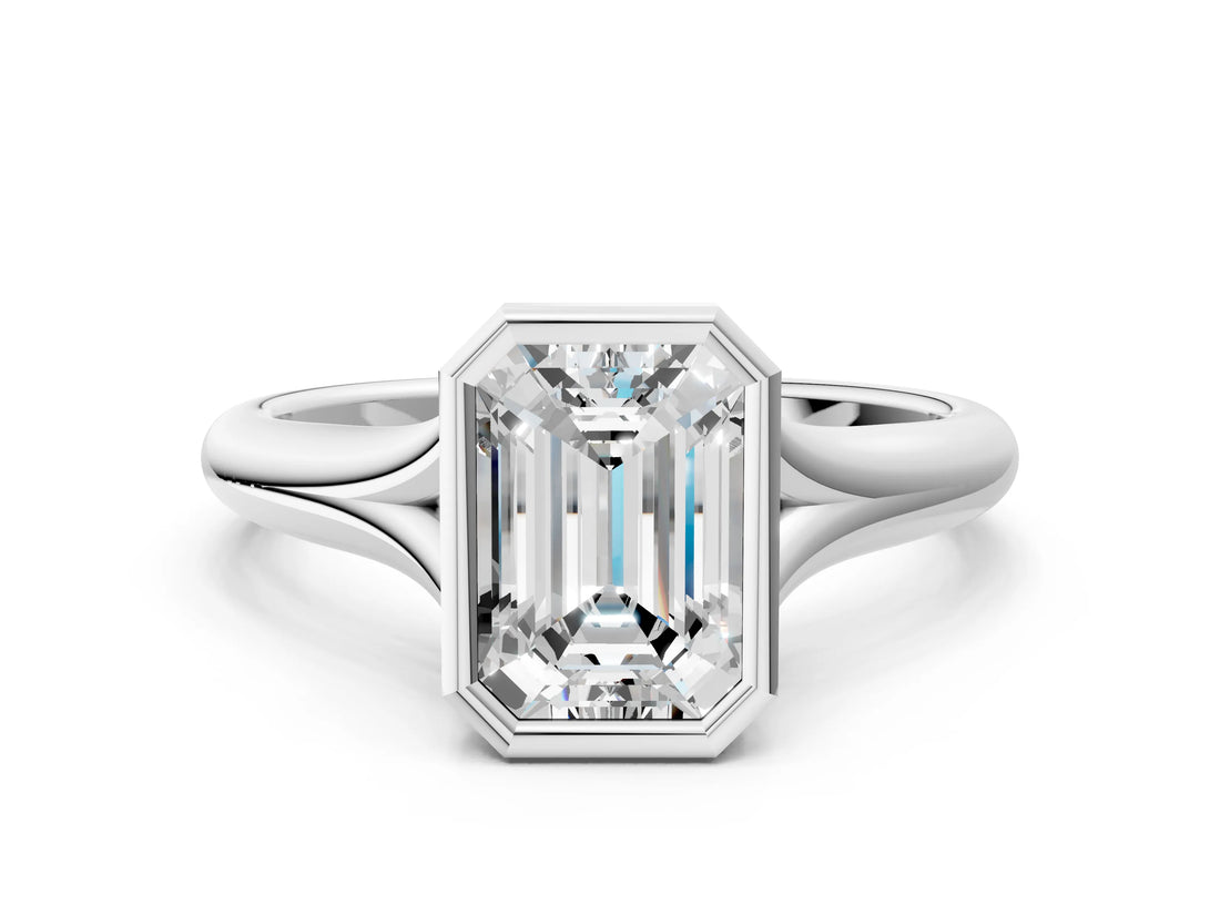 Platinum Bezel Set Emerald Solitaire Diamond Ring with Smooth Band