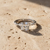Platinum Cushion Cut Diamond Ring with Marquise and Round  Side Stones and Four-Prong Setting