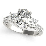 Platinum Cushion Three-Stone Diamond Ring with Pavé Band and Four-Prong Setting