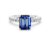 Platinum Emerald Cut Blue Sapphire Solitaire Ring with Round  Pavé Band and Four-Prong Setting_36