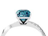 Platinum Emerald Cut Blue Topaz Engagement Ring with Side Stone Accents and Four-Prong Setting_16