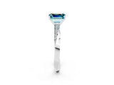 Platinum Emerald Cut Blue Topaz Engagement Ring with Side Stone Accents and Four-Prong Setting_38