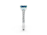 Platinum Emerald Cut Blue Topaz Solitaire Pavé Engagement Ring with Round Band and Prong Setting_86