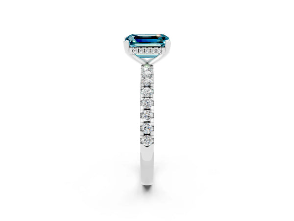 Platinum Emerald Cut Blue Topaz Solitaire Ring with Round Pavé Band and Four-Prong Setting