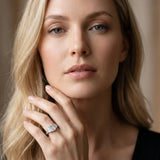 Platinum Emerald Cut Diamond Three-Stone Ring with Channel Set Band and Four-Prong Setting_65