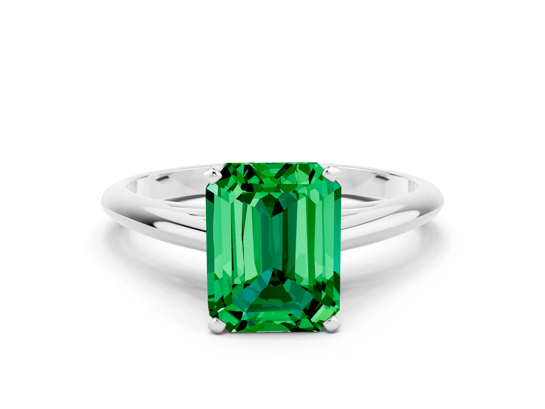 Platinum Emerald Cut Emerald Solitaire Engagement Ring with Cathedral Setting and Four-Prong Mount