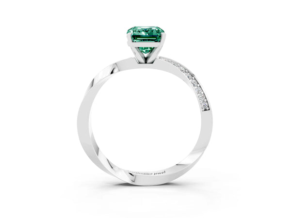 Platinum Emerald Cut Green Sapphire Engagement Ring with Side Stone Accents and Four-Prong Setting