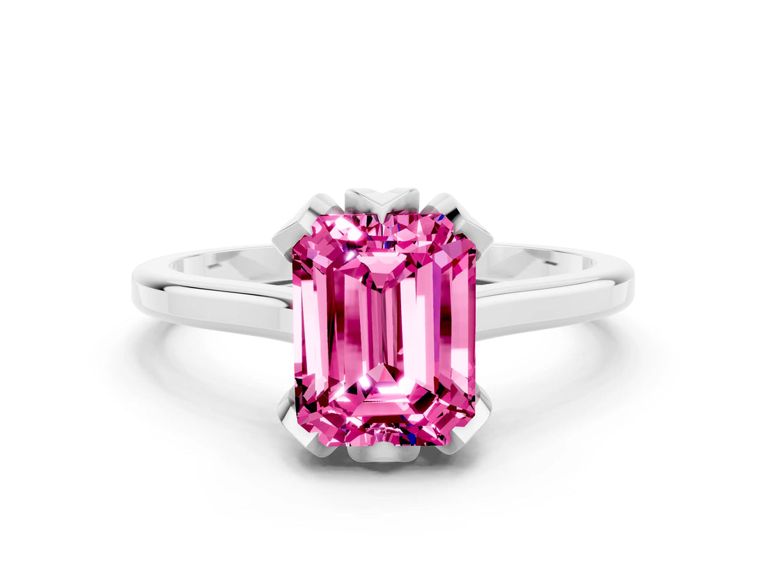 Platinum Emerald Cut Pink Sapphire Solitaire Ring with Flower Prong Setting and Classic Band