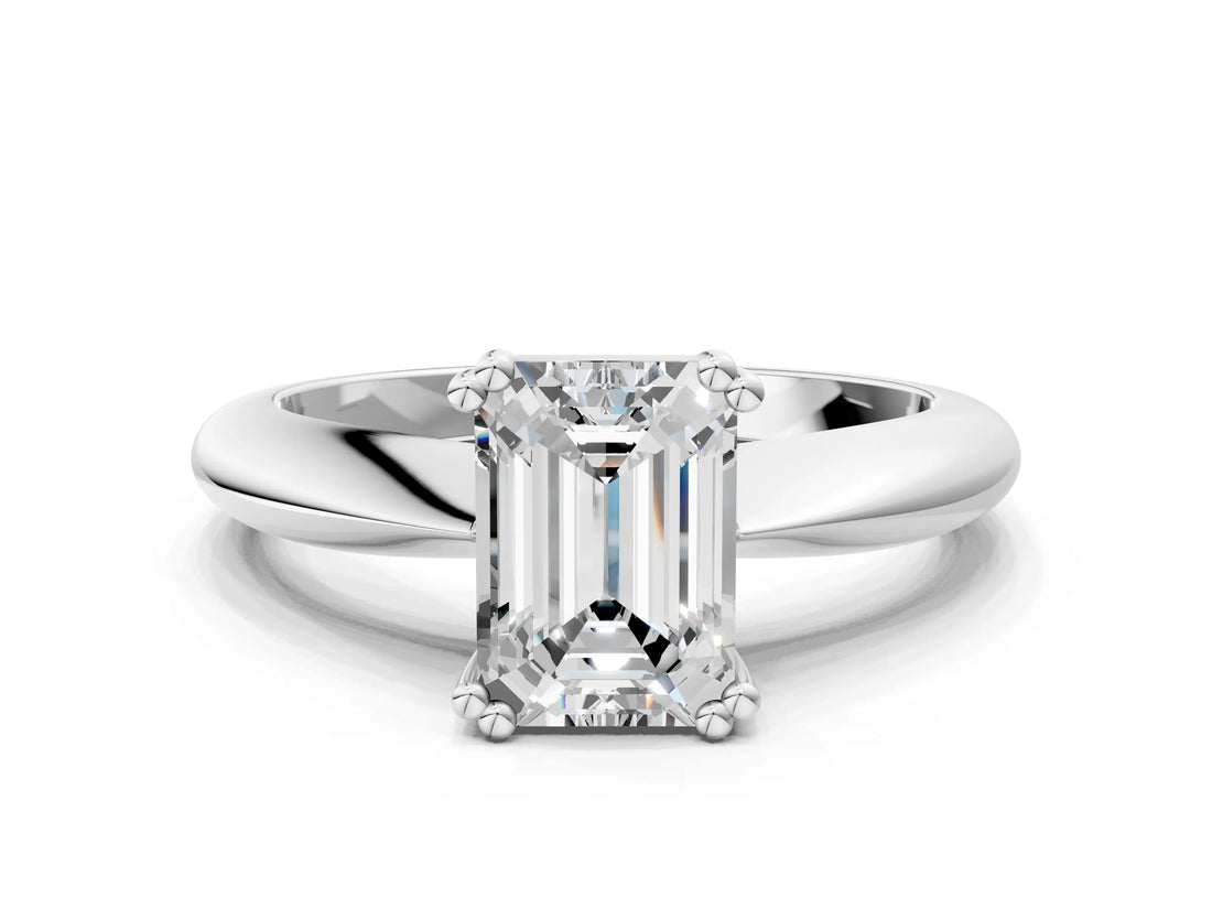 Platinum Emerald Cut Solitaire Engagement Ring with Tapered Band and Four-Prong Setting