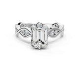 Platinum Emerald Solitaire Twist Band with Leaf Prong Setting