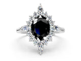 Platinum Fancy Black Oval Cut Halo Diamond Cluster Ring with Marquise and Round Stones on a White Gold Band with Prong Setting