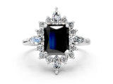 Platinum Fancy Black Radiant Cut Halo Diamond Cluster Ring with Marquise and Round Stones on a White Gold Band with Prong Setting