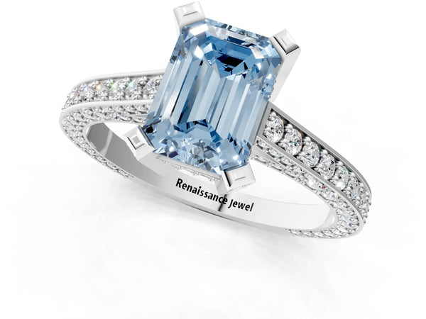 Platinum Fancy Blue Emerald Cut Brilliant Split Shank Pave Solitaire Ring with Four-Prong Setting
