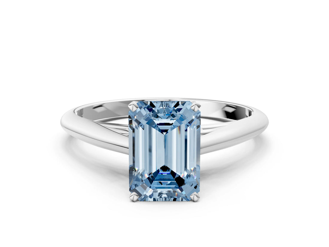 Platinum Fancy Blue Emerald Cut Diamond Solitaire Engagement Ring with Cathedral Setting and Four-Prong Mount