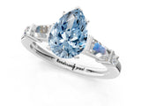 Platinum Fancy Blue Pear  Cut Diamond Ring with Baguette Side Stones, Channel Set Band, and Four-Prong Setting_25