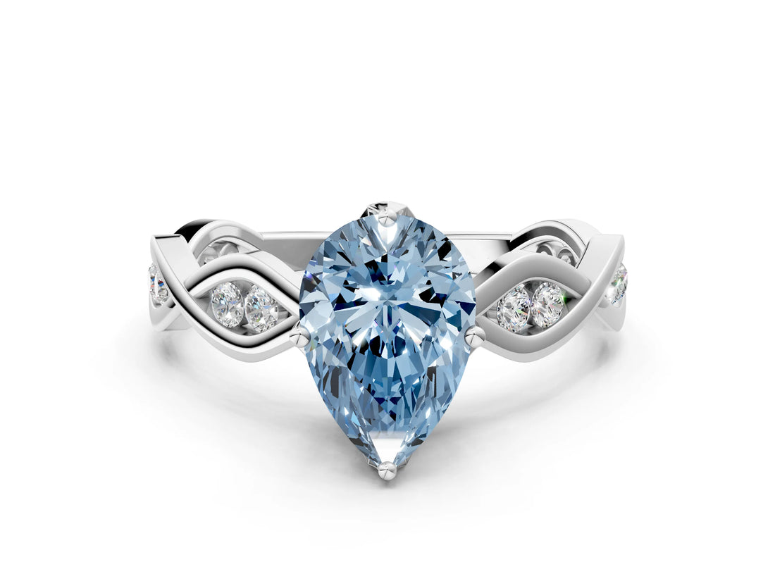 Platinum Fancy Blue Pear  Solitaire Twist Band with Leaf Prong Setting 1