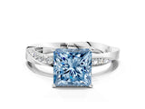 Platinum Fancy Blue Princess Cut Diamond Engagement Ring with Side Stone Accents and Four-Prong Setting
