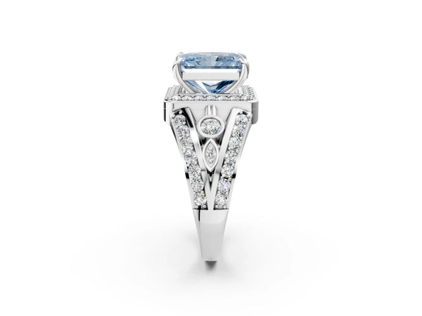 Platinum Fancy Blue Radiant Cut Diamond Halo Ring with Split Shank and Bezel Accents and Four-Prong Setting