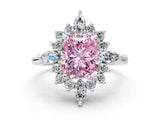 Platinum Fancy Pink Radiant Cut Halo Diamond Cluster Ring with Marquise and Round Stones on a White Gold Band with Prong Setting