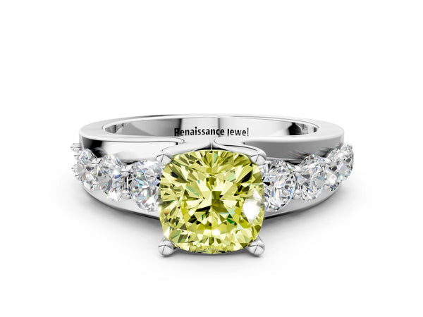 Platinum Fancy Yellow Cushion  Brilliant Solitaire with Side Stones on a Pave Band and Four-Prong Setting