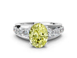 Platinum Fancy Yellow Oval  Brilliant Solitaire with Side Stones on a Pave Band and Four-Prong Setting_12