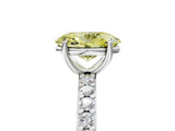 Platinum Fancy Yellow Oval  Cut Diamond Solitaire with Pave Band and Four-Prong Setting