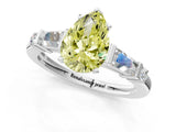 Platinum Fancy Yellow Pear  Cut Diamond Ring with Baguette Side Stones, Channel Set Band, and Four-Prong Setting_13