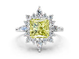 Platinum Fancy Yellow Princess Cut Halo Diamond Cluster Ring with Marquise and Round Stones on a White Gold Band with Prong Setting