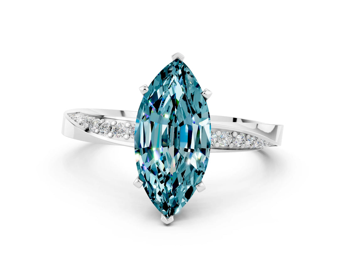 Platinum Marquise Cut Blue Topaz Engagement Ring with Side Stone Accents and Four-Prong Setting_24