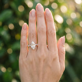 Platinum Marquise Cut Diamond Ring with Marquise and Round  Side Stones and Four-Prong Setting