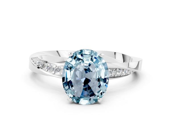 Platinum Oval Cut Aquamarine Engagement Ring with Side Stone Accents and Four-Prong Setting