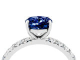 Platinum Oval Cut Blue Sapphire Pavé Solitaire Ring with Round Band and Prong Setting_76
