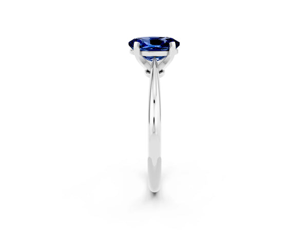 Platinum Oval Cut Blue Sapphire Solitaire Engagement Ring with Classic Band and Four-Prong Setting